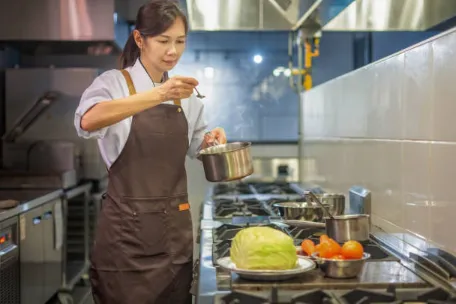 Contemporary commercial kitchen with stainless steel restaurant gear.