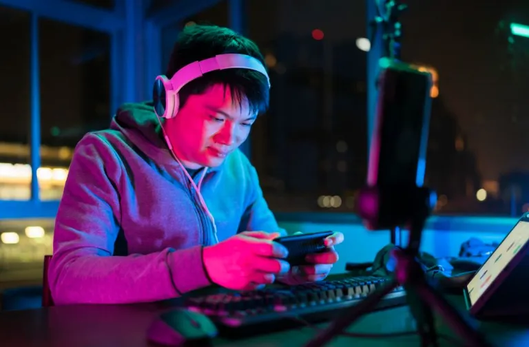 Level Up On A Budget Best Low-Cost Online Tools For Aspiring Gaming Influencers Image Link- httpswww.canva.comdesignDAG9tb7UaeUhLMU739rq0yIEOEYhaQ71Aeditutm_content=DAG9tb7UaeU&utm_campaign=designshare&utm_medium=link2&utm_source=sharebutton Most aspiring gaming influencers don’t fail because they’re not entertaining—they fail because their workflow is expensive, messy, and inconsistent. The good news is you don’t need a studio budget to look and sound professional, post on schedule, and grow a recognizable brand. What you need is a lean “creator stack” that covers capture, editing, design, distribution, and community without paying for five subscriptions at once. Below are a few practical, low-cost tips built around online tools and lightweight habits that compound over time. Build a no-drama streaming setup with OBS + Streamlabs A clean stream doesn’t start with fancy gear; it starts with stable scenes, consistent audio levels, and overlays that don’t distract from gameplay. OBS Studio is free and open-source, and it’s widely used for recording and live streaming, which makes it a reliable “core” tool as you scale. Streamlabs is useful when you want fast alerts, overlay options, and tippingmerch features without custom coding. The budget move is to keep your layout minimal gameplay first, face-cam second, and only one or two readable on-screen elements. Create one “Base Scene” (game + mic + cam) and duplicate it for every game so you’re not rebuilding from scratch. Save a “Troubleshooting Scene” (just mic + cam) so you can instantly test audio on stream without tab chaos. Edit faster by choosing one “main editor” and one “shorts editor” Consistency beats complexity, so pick one editor you’ll actually open every day—then add a second tool only for short-form speed. DaVinci Resolve is built as an all-in-one post-production suite (editing, effects, color, and audio pages), which makes it a strong long-term pick even if you start simple. For quick online edits and template-driven pacing, CapCut’s online editor is designed to help creators move fast and includes creator-friendly features like captions and other automation tools. The unique tip define a repeatable “clip recipe” (hook → highlight → reaction → CTA) and reuse it every time. Keep a “Reusable Assets” folder intro sting, subscribe bumper, and a couple sound effects you always use. Export one preset per platform (YouTube, ShortsReels, TikTok-style vertical) so you’re never guessing settings. Make thumbnails and channel art without paying for heavyweight design suites Gaming channels win clicks with clarity big readable text, one focal subject, and one emotion (hype, shock, victory, fail). Photopea runs in the browser and supports common formats like PSD, which is ideal when you’re editing layered templates without committing to a monthly plan. If you prefer installed software, GIMP is a free, cross-platform image editor with a strong ecosystem of tutorials and plugins. The “influencer cheat” is to design a thumbnail template once, then swap the game logo, face reaction, and one key word per upload. Create a 3-template set “Win,” “Fail,” and “Guide,” each with consistent fonts and placement. Test readability at phone size by zooming out until the thumbnail is tiny; if it’s still legible, it’s ready. Clean up audio cheaply with Audacity + a repeatable mic routine Bad audio kills retention faster than slightly blurry video, and it’s the easiest upgrade to make with free tools and discipline. Audacity is a popular free audio editor and recorder, so it’s perfect for fixing levels, trimming noise, and improving voice clarity. The key is not endless tweaking—it’s a repeatable mic routine same distance, same gain, same room setup. Record a 10-second “room tone” once, then reuse it to help your noise reduction behave consistently across sessions. Normalize voice tracks to a consistent target so your videos don’t jump in loudness between uploads. Save an Audacity preset chain (noise reduction → compressor → limiter) and apply it every time. Plan content like a small studio with Trello or Notion Creators burn out when ideas live in ten places, so give yourself one home base for concepts, scripts, and publishing dates. Trello is designed to capture and organize tasks using boards, and it’s easy to maintain a simple pipeline like Ideas → Recording → Editing → Posted. Notion is a flexible workspace for notes and planning, which is great when you want scripts, research, and “series bibles” in one place. The unique move is to build a “series system” (e.g., weekly challenge runs, monthly reviews) so you’re not inventing a new format every upload. Add a “Retention Hook” field to each card. Add a “Repurpose Plan” field. Distribute smarter with a single link hub and a light scheduler Gaming influencers often lose momentum because posting feels like a daily scramble across platforms, so automate the boring parts. Linktree gives you one link to share everything you create, which is a simple way to route followers to your latest video, Discord, and merch without rewriting bios constantly. Buffer is a social media management tool built to help you create, organize, and schedule content, and it’s useful when you want consistency without living inside every app. The unique tip here is “batch and stagger” batch-create five posts, then stagger them across the week so your channel looks active even when you’re editing. Create a weekly posting cadence one long video, two shorts, and one community post recap. Track one metric per platform (watch time, saves, comments) so you improve what matters instead of chasing vanity numbers. 🎮 Mug Design FAQ for Gaming Influencers Mugs are one of the easiest “first merch” items because they’re practical, giftable, and work well with simple graphics like emblems, catchphrases, and inside jokes from your stream. What size and layout should I use so my mug art prints cleanly Design at high resolution, keep key text away from the edges, and avoid ultra-thin lines so your logo and lettering don’t look fuzzy when wrapped around a curved surface. How do I make a mug design fast without being a pro designer Use a template-based editor to build a clean layout with one bold phrase, one icon, and one accent color, and if you want an easy starting point you can try a mug designer. Which print-on-demand services are good for testing mug merch without inventory Printful, Printify, and Gelato all support on-demand mugs so you can upload a design, order a sample, and sell without pre-buying stock, which is ideal when you’re validating demand from a growing audience. How do I avoid ugly colors or “washed out” prints on mugs Stick to high-contrast palettes, export in a print-friendly format, and order at least one sample before promoting—because lighting, mug coating, and sublimation can shift colors more than you expect. Where can I sell mugs if I don’t want to build a full store yet Marketplaces like Zazzle let you publish mug designs and test themes quickly, which can be helpful when you’re experimenting with slogans, mascots, or seasonal drops tied to game launches. Low-cost tools don’t make you a creator—systems do, and tools simply reduce friction so you can execute that system every week. A budget-friendly stack should cover capture, editing, design, planning, and distribution without requiring you to “learn a new app” every time you sit down to work. If you commit to templates (scenes, thumbnails, clip recipes, and post formats), you’ll ship more content with less mental load. The compounding advantage comes from consistency tighter audio, clearer thumbnails, and a predictable series format that viewers recognize. Build a workflow you can repeat, not a setup you can brag about. Your goal is simple publish reliably, look professional, and earn the right to grow—one clean, focused improvement at a time.